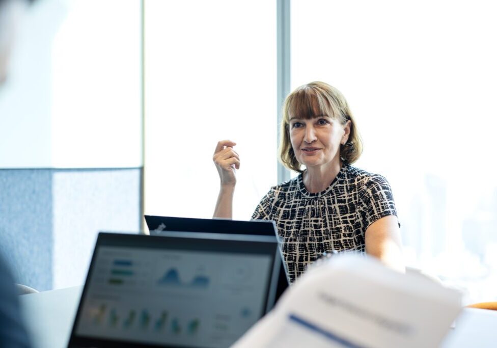 Aligning Risk Management with Business Strategy to Enhance Confidence for Your Business. Senior Business Executive in business performance meeting to determine direction with partner in a modern business office. Business Relationship, Corporate Business.